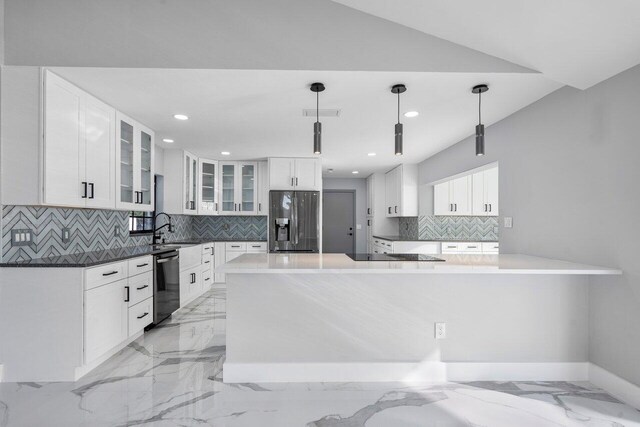 kitchen with glass insert cabinets, dishwashing machine, decorative light fixtures, white cabinetry, and stainless steel fridge