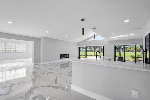51 Woods Ln, Boynton Beach, FL 33436 - living area with recessed lighting, a glass covered fireplace, baseboards, light marble finish flooring, and lofted ceiling