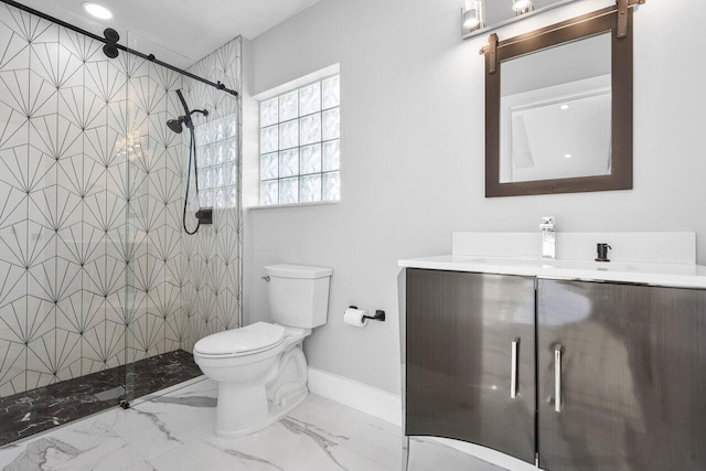 full bath with baseboards, vanity, toilet, a tile shower, and marble finish floor