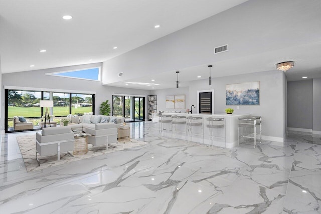 51 Woods Ln, Boynton Beach, FL 33436 - living room featuring recessed lighting, high vaulted ceiling, and baseboards