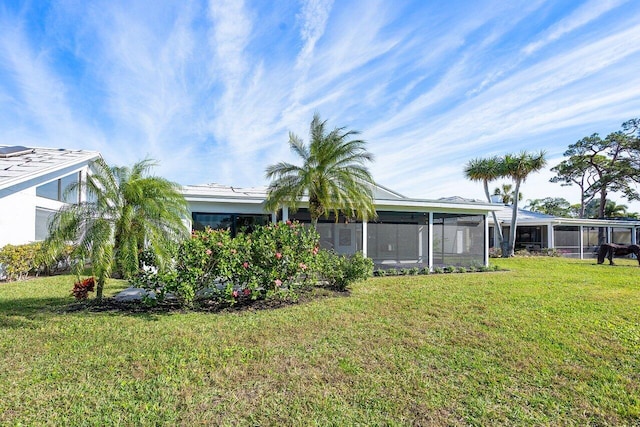 view of yard featuring a sunroom