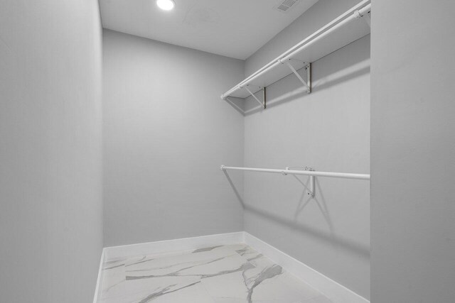 51 Woods Ln, Boynton Beach, FL 33436 - walk in closet featuring marble finish floors