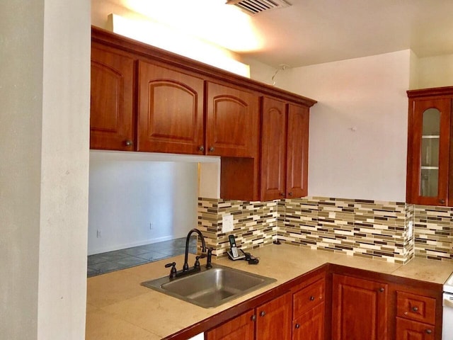 kitchen with sink and decorative backsplash