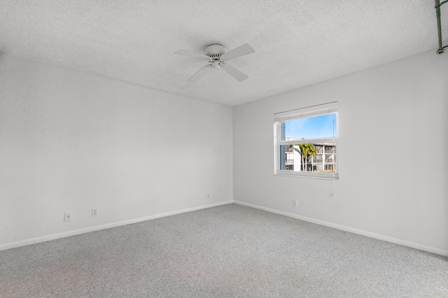 spare room with ceiling fan, carpet floors, and a textured ceiling