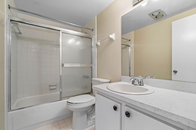 full bathroom featuring toilet, tile patterned floors, shower / bath combination with glass door, and vanity