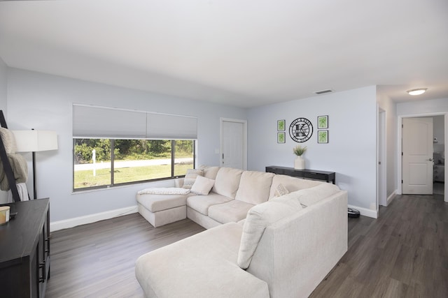 living room with dark hardwood / wood-style floors