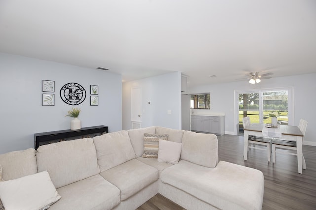 living room with hardwood / wood-style flooring and ceiling fan