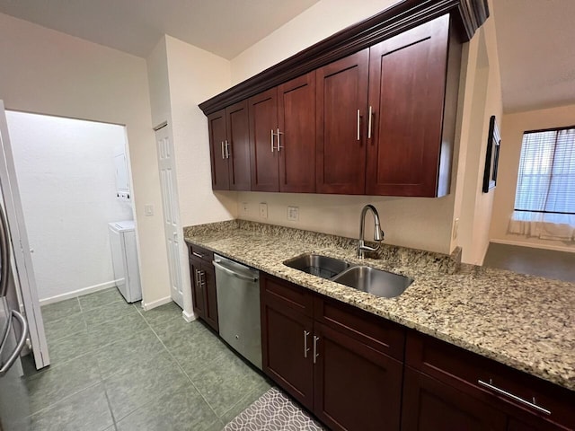 kitchen featuring sink, dishwasher, refrigerator, and light stone countertops