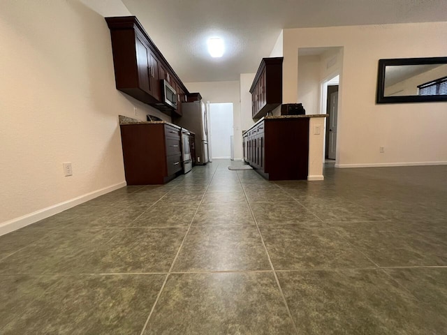 kitchen with dark brown cabinets and stainless steel appliances