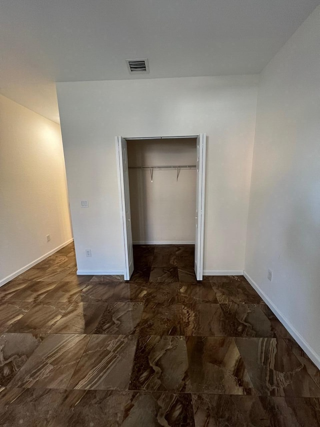 unfurnished bedroom featuring a closet