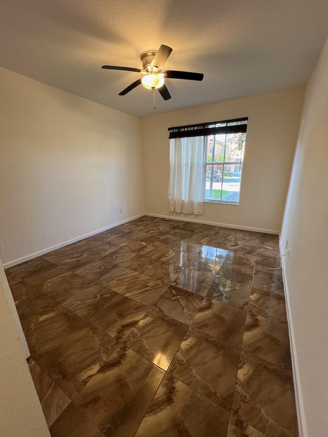 empty room with ceiling fan