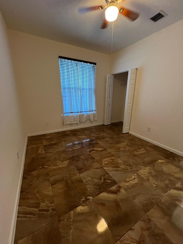 spare room featuring ceiling fan