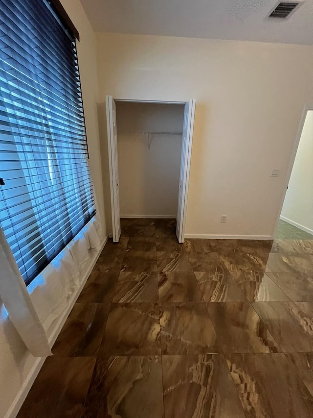 unfurnished bedroom featuring a closet