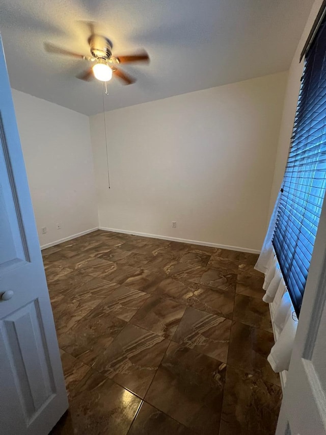 unfurnished room featuring ceiling fan