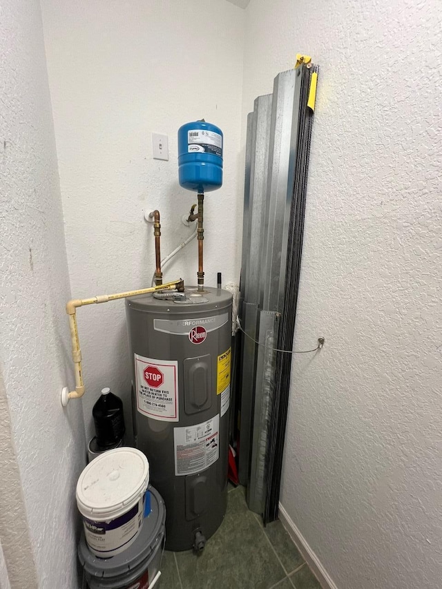 utility room featuring electric water heater