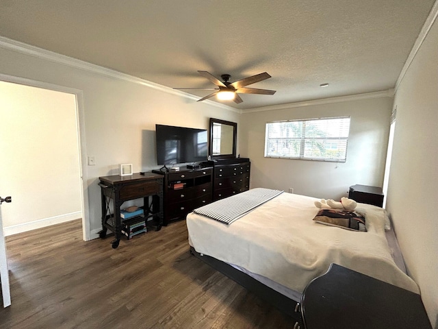 bedroom featuring crown molding, dark wood-type flooring, a textured ceiling, and ceiling fan