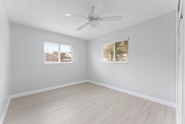 unfurnished room with light hardwood / wood-style floors and ceiling fan