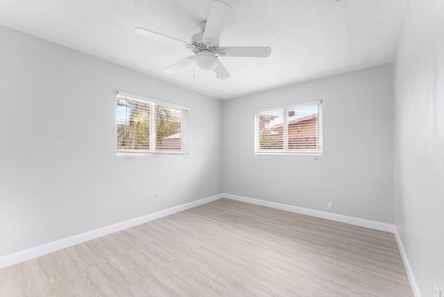 spare room featuring ceiling fan and light hardwood / wood-style floors