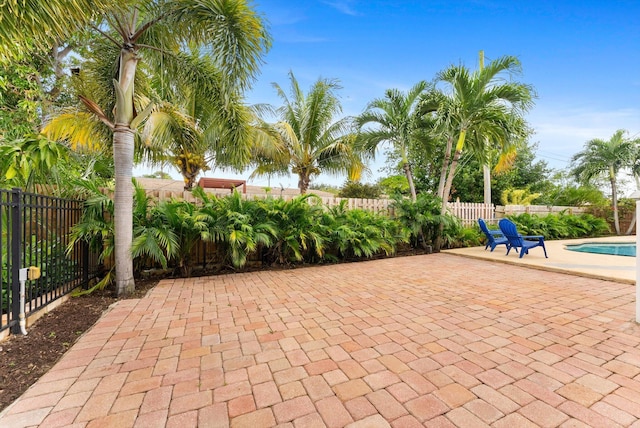 view of patio / terrace featuring a fenced in pool