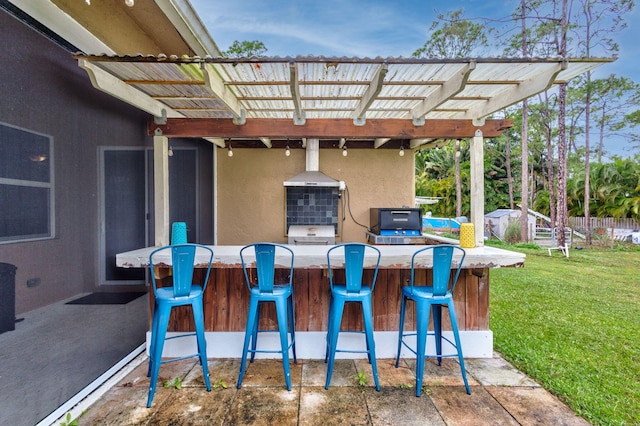 view of patio featuring an outdoor bar