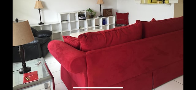 living room featuring light tile patterned flooring