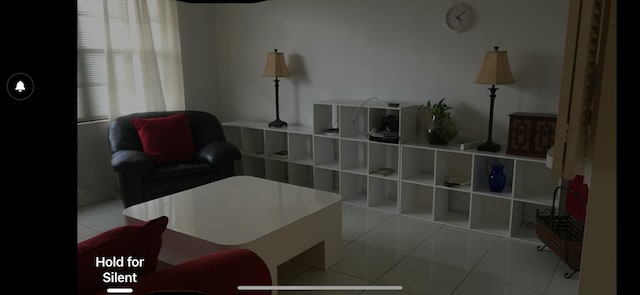 living area featuring light tile patterned flooring