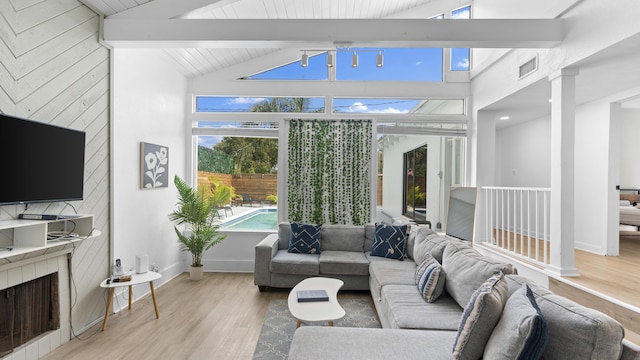 sunroom with vaulted ceiling with beams