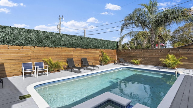 view of swimming pool featuring a wooden deck