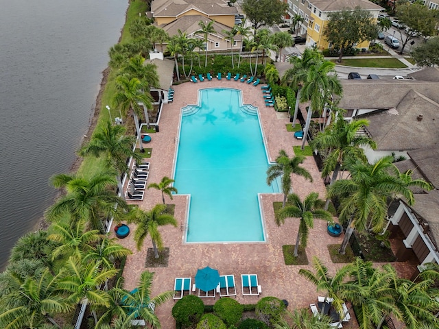 view of swimming pool with a water view