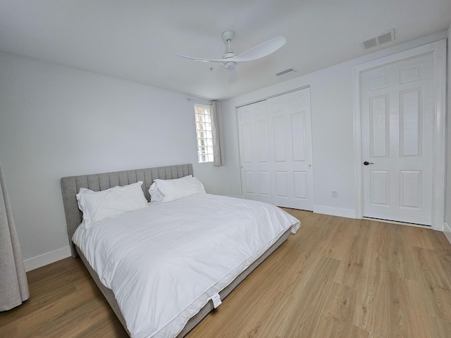 bedroom featuring a closet, ceiling fan, and wood-type flooring