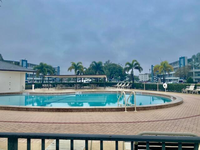 view of swimming pool featuring a patio area