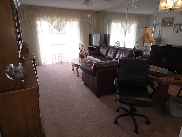 living room with carpet floors and ceiling fan