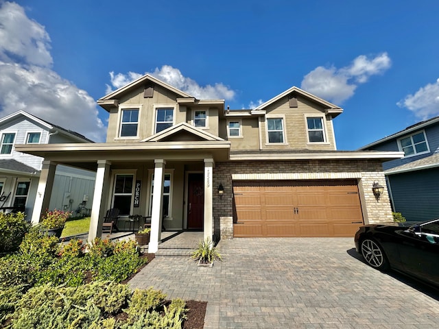 view of front of house with a garage and covered porch