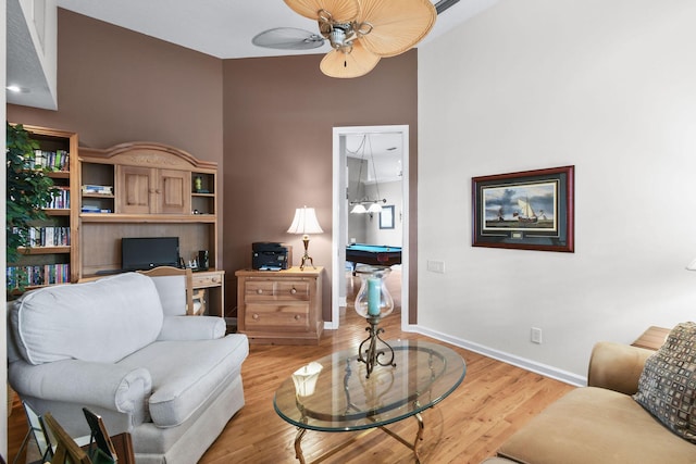 interior space featuring baseboards, pool table, a ceiling fan, and light wood-style floors