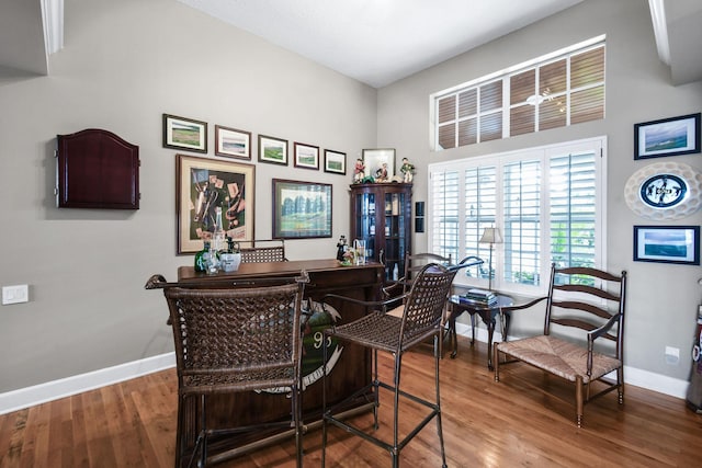 office space with wood finished floors and baseboards