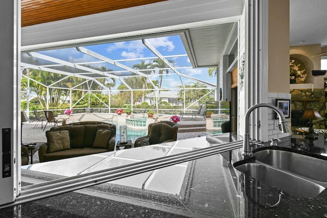 interior space featuring a sunroom and a sink