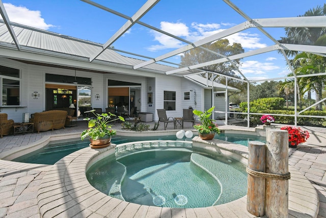 view of pool with an outdoor hangout area, a patio area, and a pool with connected hot tub