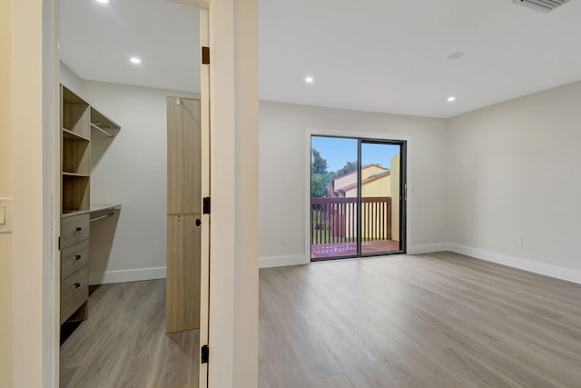 spare room featuring light wood-type flooring