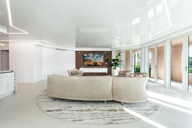 living room with a high ceiling