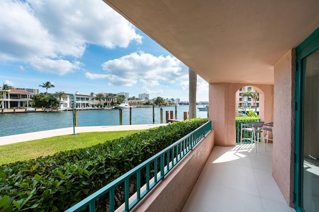 balcony featuring a water view