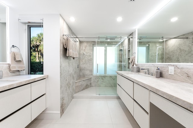 bathroom featuring vanity, decorative backsplash, and walk in shower