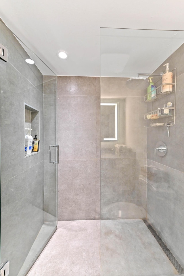 bathroom with a shower with shower door