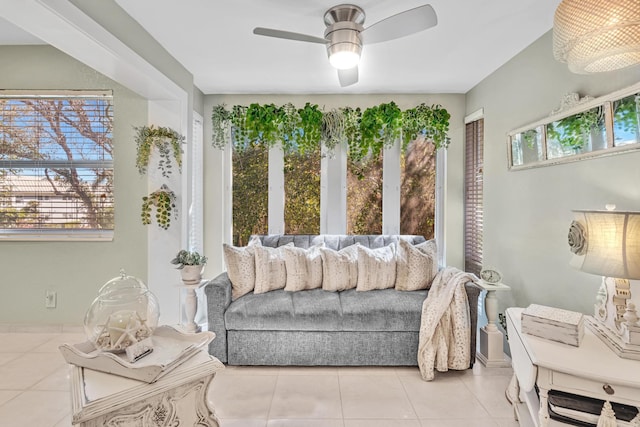 interior space with ceiling fan and light tile patterned floors