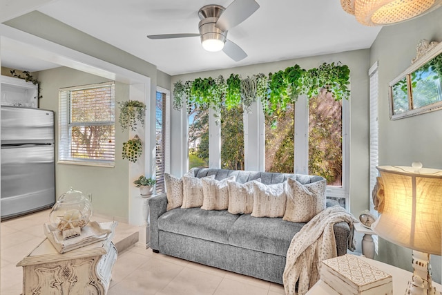 interior space featuring light tile patterned floors and ceiling fan