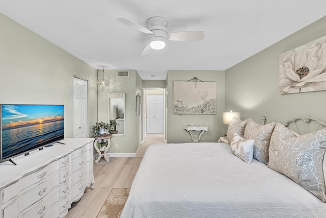 bedroom with ceiling fan and light wood-type flooring