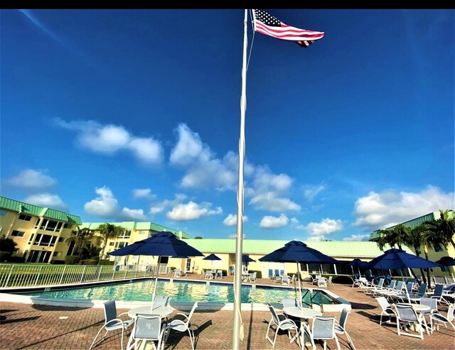 view of dock featuring a community pool