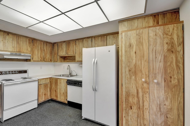 kitchen with white appliances and sink