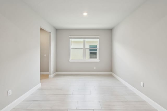 empty room featuring baseboards