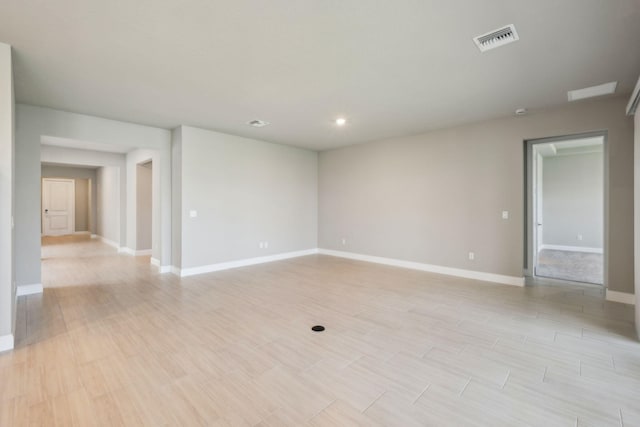 unfurnished room featuring visible vents, recessed lighting, light wood-style flooring, and baseboards