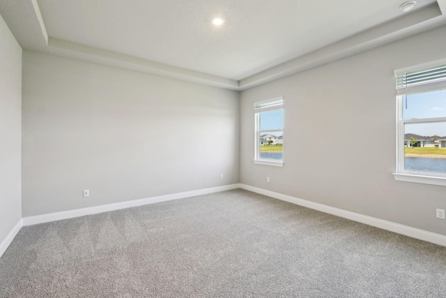 carpeted spare room with recessed lighting and baseboards